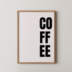 פוסטר טיפוגרפי עם כיתוב COFFEE באותיות שחורות על רקע בהיר, מתאים לפינת קפה במטבח.