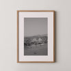 Quiet Harbor by Daniel Barlot – black and white Fine Art photograph of sailboats anchored in a peaceful Mediterranean harbor in Greece, framed in natural oak.