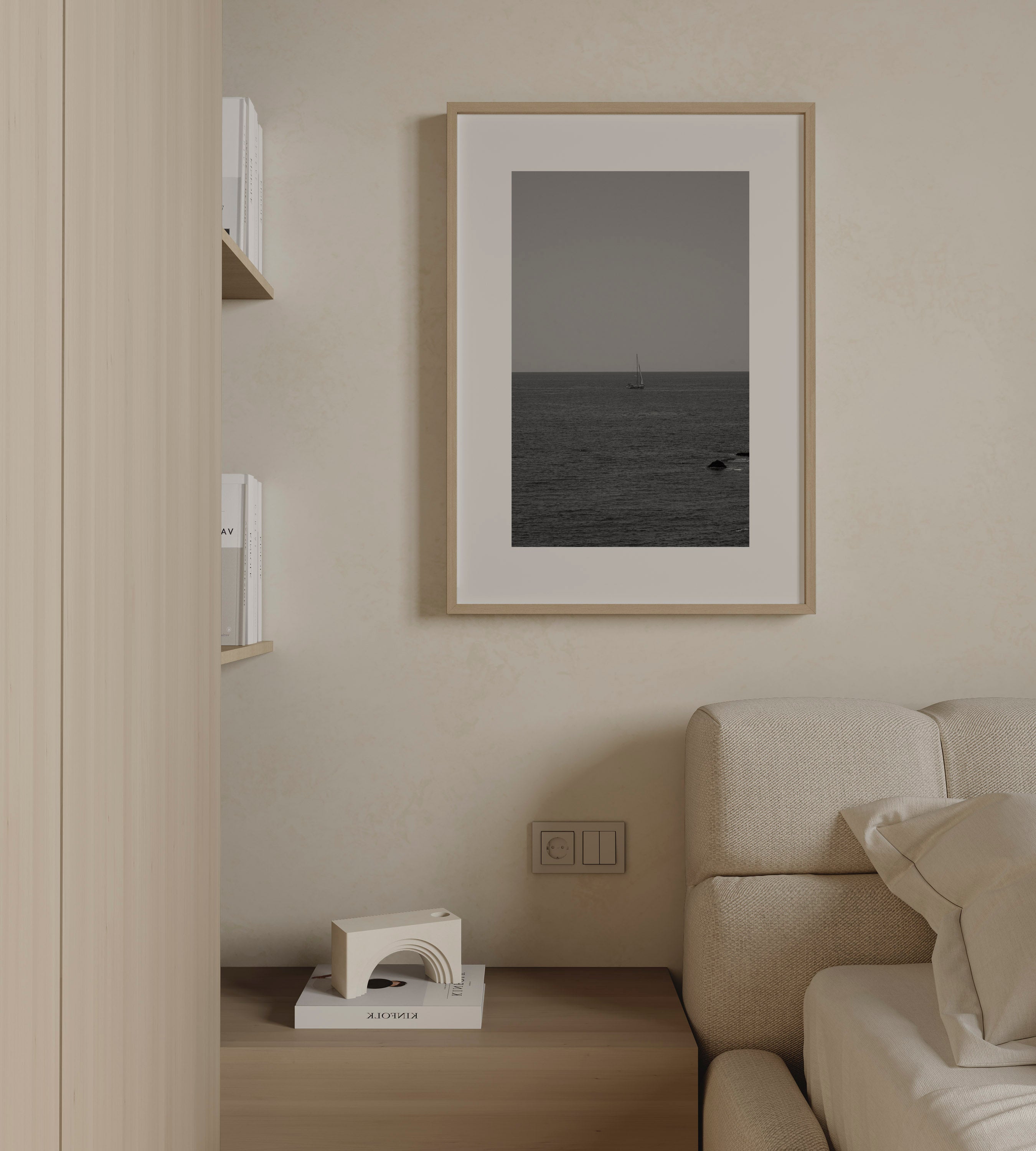 The Quiet Voyage by Daniel Barlot – minimalist black and white fine art photograph of a lone sailboat sailing across the Mediterranean horizon, framed in natural oak.